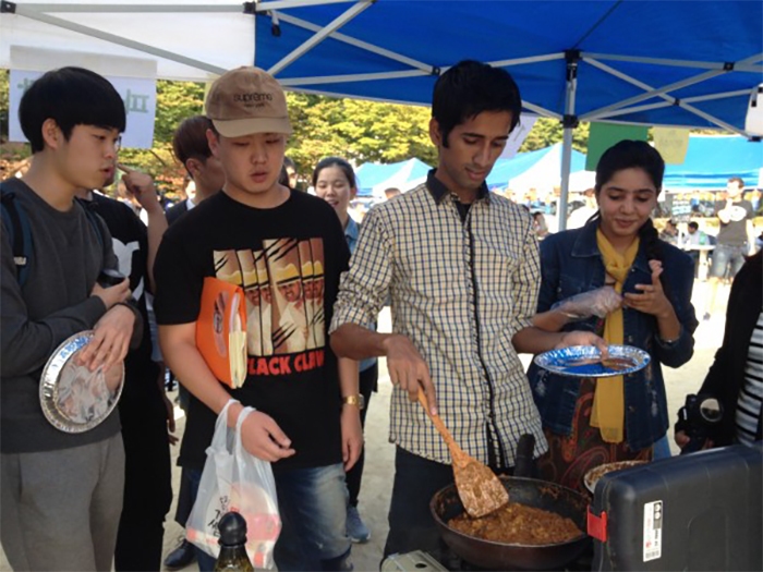 I cook traditional Pakistani food during the International Food Festival at Keimyung University.