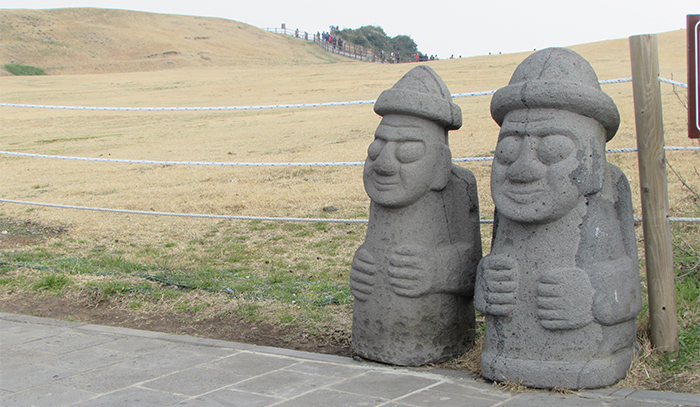 <i>Dol hareubangs</i> are greeting my visit to the Jeju Island. They are large rock statues and are considered to be gods offering both protection and fertility.