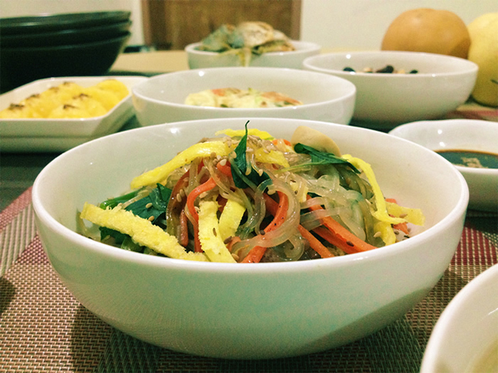 One of the most loved Korean dishes is <i>japchae</i>. It's made with clear, sweet potato starch noodles stir-fried with meat and vegetables.