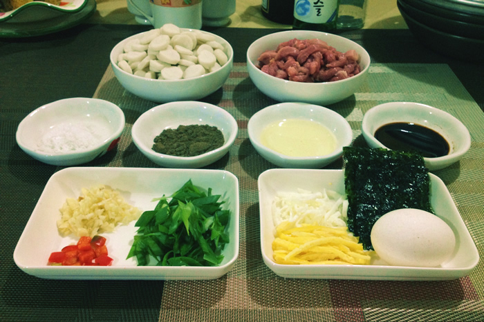 Fresh, colorful ingredients are prepared for a savory rice cake soup, or <i>tteokguk</i>.
