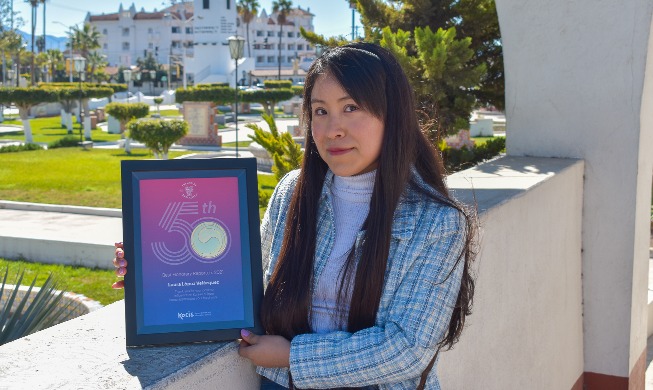 Laura Lopez Velazquez poses with her Best Honorary Reporters award from last year. 