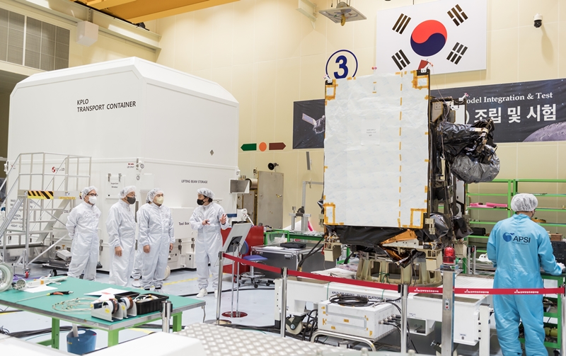 Staff of Korea Aerospace Research Institute's center for satellite assembly gather for final preparations to relocate the Danuri lunar orbiter to the launch site. 