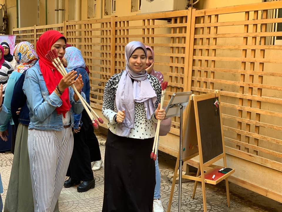 Participants in 2019 play the traditional Korean game tuho (arrow throwing) during a Chuseok event hosted by the Korean Cultural Center in Egypt. (KCC in Egypt) 