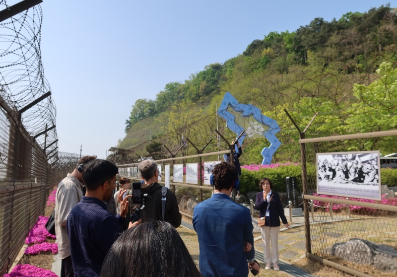 Foreign news correspondents on a media tour of DMZ Peace Trail on April 27 listen to an explanation at Gangwha County 6.25 Veterans Memorial Park in the town of Ganghwa-eup in Incheon's Ganghwa-gun County. (Kim Hyelin) 