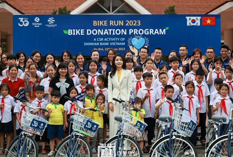 First lady Kim Keon Hee on June 22 takes a photo at Bike Run, a charity event at SOS Children's Village in Hanoi, Vietnam. (Office of the President) 