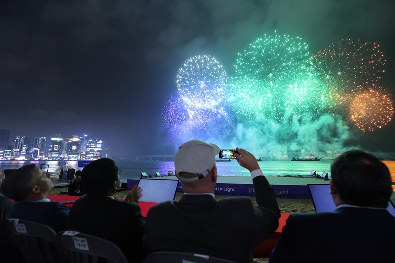 Members of the International Bureau of Expositions (BIE) in April watch a fireworks display above the Gwangandaegyo Bridge in Busan's Suyeong-gu District. (World Expo 2030 Busan Bid Committee's official Facebook page) 