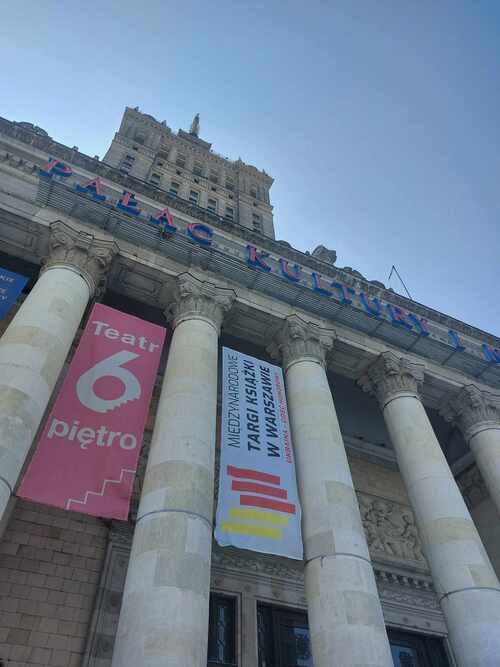 A poster for the Warsaw International Book Fair poster hangs on the Palace of Culture and Science in Warsaw, Poland.