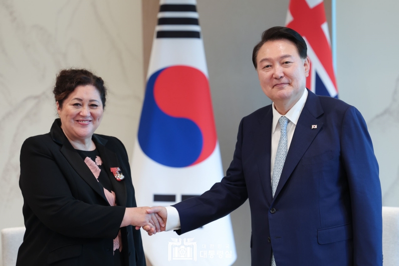 President Yoon Suk Yeol shakes hands with New Zealand Governor-General Cindy Kiro at the presidential office in Seoul. 
