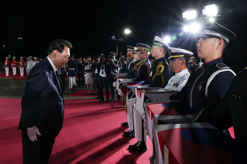 President Yoon Suk Yeol pays his respects on July 26 with a moment of silence for soldiers killed during the Korean War at a ceremony for the repatriation of their remains held at Seoul Air Base in Seongnam, Gyeonggi-do Province.