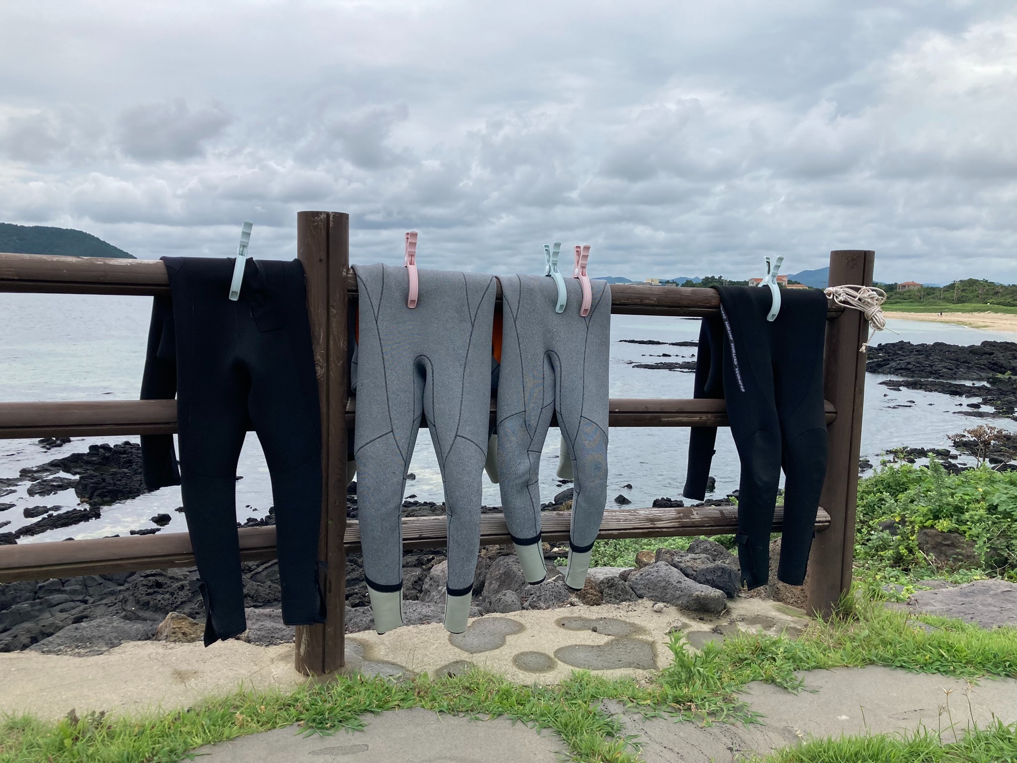 Diving suits on July 21 are dried outdoors after the haenyeo experience at the interactive Hado Fishing Village in the town of Gujwa-eup on Jeju Island. (Charles Audouin) 