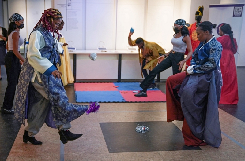 Participants on Sept. 13, 2022, play the traditional game jegichagi (kicking a shuttlecock) at a Chuseok (Thanksgiving) event held at the Korean Cultural Center (KCC) in Abuja, Nigeria. (KCC in Nigeria)