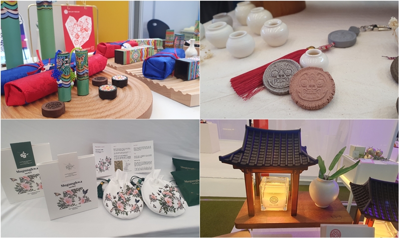 These items are on display at the Souvenir Fair 2023 on Nov. 24 at Dongdaemun Design Plaza in Seoul's Jung-gu District. Clockwise from top left are Hangeul dojang (personal seal stamps) decorated with dancheong (traditional decorative coloring) designs; magnets shaped like moon jars or goblin faces; candle holder (warmer) and stand featuring a Hanok (traditional house) design; and incense pouches featuring the scent of Korea's national flower mugunghwa (rose of Sharon). 