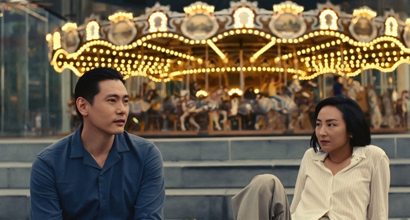 Actors Teo Yoo (right) and Greta Lee appear in a scene from the film 