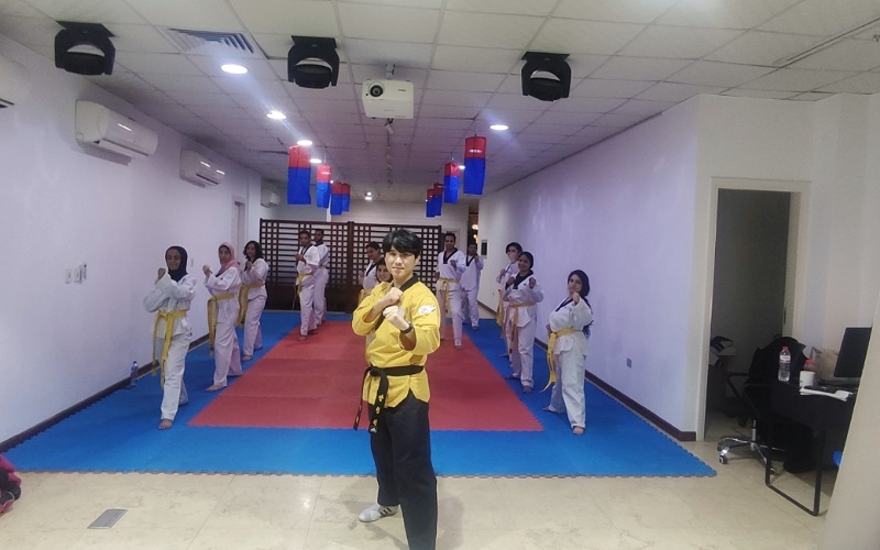 Instructor An Hyung-won on Feb. 1 poses with students at the Taekwondo Academy of the KCC in Egypt.