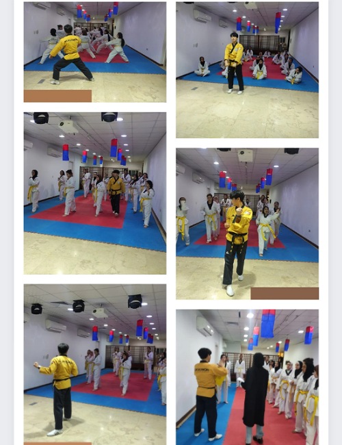 Instructor An explains taekwondo techniques with the help of an interpreter.