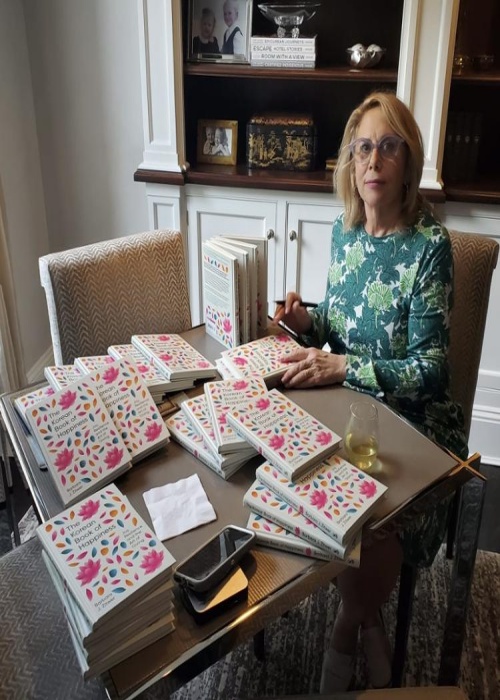 American author and literary agent Barbara J. Zitwer autographs a copy of her book 