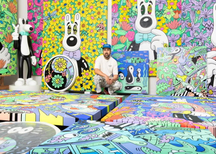 Los Angeles-based artist Steven Harrington poses with his works. (Steven Harrington) 