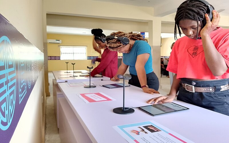 University of Abuja students watch Korean content on tablet PCs at the Korean Corner. 