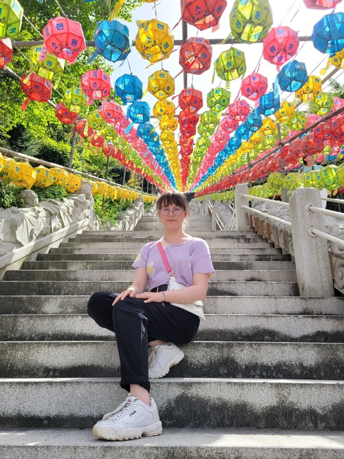 Honorary Reporter Zuzanna Klonowska poses for a photo on the main stairs leading to Samgwangsa Temple.
