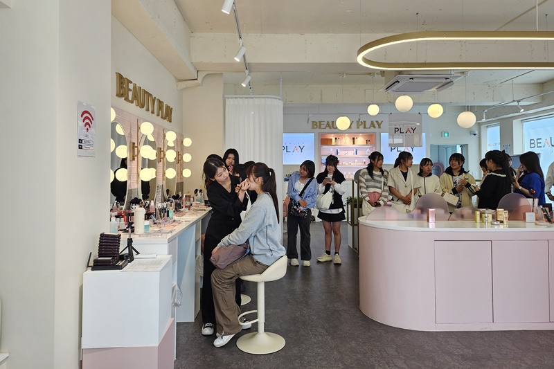 Students from Matsuyama Higashi High School in Ehime Prefecture, Japan, line up to get a makeover after attending a personal color semi