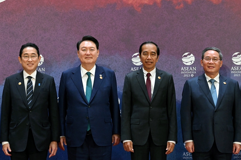 President Yoon Suk Yeol (second from left) in September 2023 poses for photos with Japanese Prime Minister Fumio Kishida (left), Chinese Prime Minister Li Qiang (right) and Indonesian President Joko Widodo at the ASEAN Plus Three Summit in Jakarta, Indonesia. (Kang Min Seok from Office of the President)  
