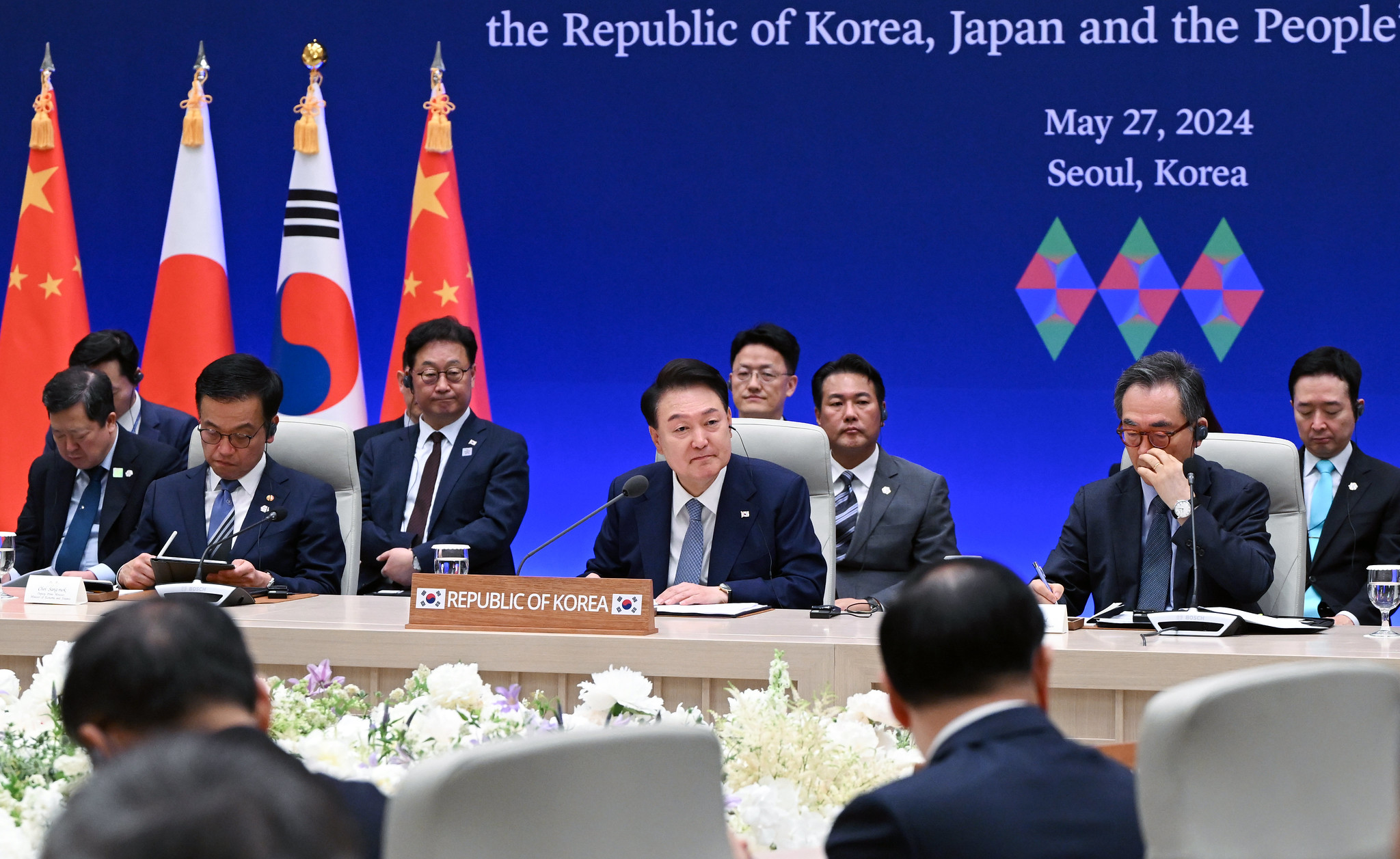 President Yoon Suk Yeol on May 27 listens to a speech at the ninth trilateral summit among Korea, Japan and China at the state guesthouse Yeongbingwan within the former presidential compound Cheong Wa Dae in Seoul. (Kang Min Seok from Office of the President)