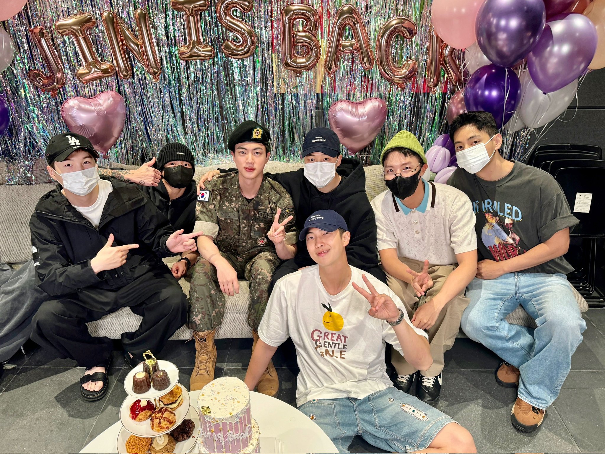 To mark his discharge from the military, Jin (third from left in second row) on June 12 reunites with BTS members at the headquarters of their management agency Hybe Entertainment in Seoul's Yongsan-gu District. (BTS' official X account) 