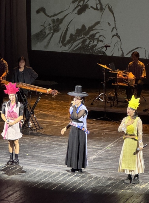 This photo shows ADG7 performing on stage. 