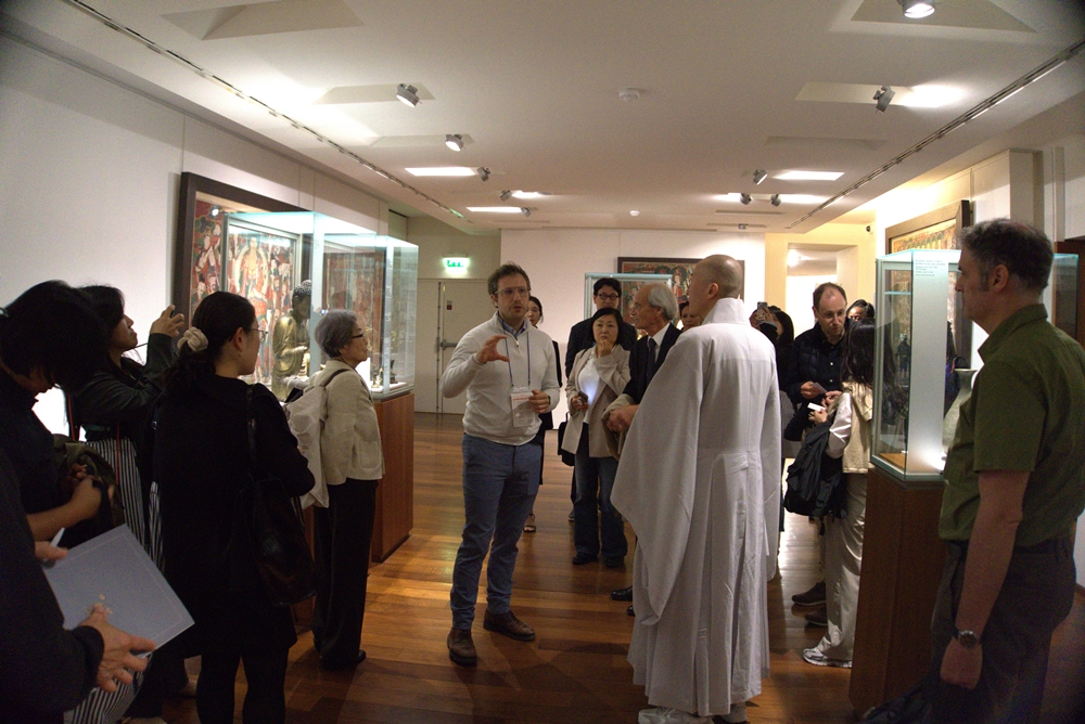 Guimet Museum curator Arnaud Bertrand (middle) on Sept. 9 explains Korean cultural heritage at the Korean collection corner of his museum in Paris. (Overseas Korean Cultural Heritage Foundation)