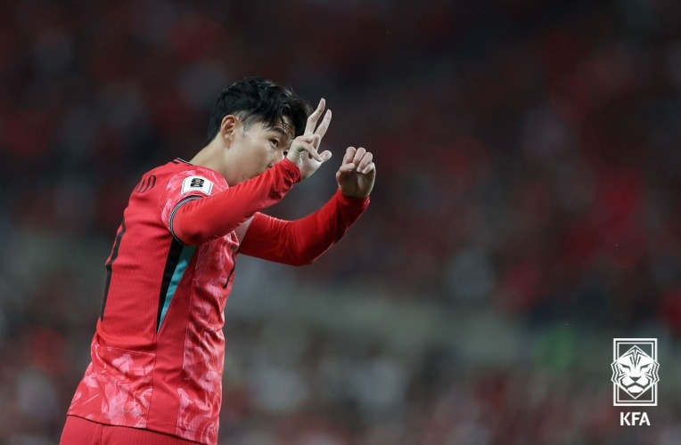 Soccer star Son Heung-min on June 11 shows three fingers in an Asian qualifier at Seoul World Cup Stadium against China for the 2026 FIFA World Cup in North America. His gesture in the 1-0 win referred to his team's 3-0 victory over the same foe on Nov. 21, 2023, in a second-round World Cup qualifier.