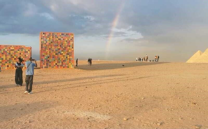 The rainbow in the middle of the artwork and the pyramids- By Omnia Ameer