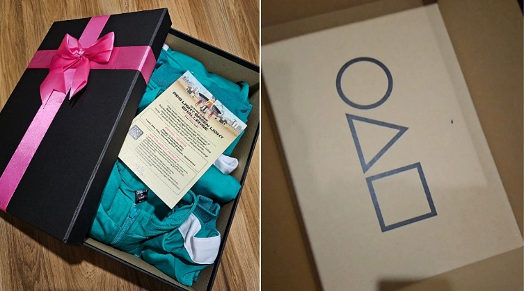 The Squid Game green tracksuit is sent to the invited players in a black gift box with a pink bow. The iconic logo of the game is printed at the inner bottom of the box. 
