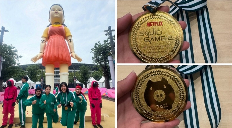 LEFT- Honorary Reporters from Indonesia who made it to the top 10 finishers, Spinela Sipayung (player 410) and  Intan Permata Sari (wearing a red hijab) took a photo with the giant Young-hee and pink guards. RIGHT – The top and back sides of the special medal given to the top 10 finishers (Photo by: Spinela Sipayung).