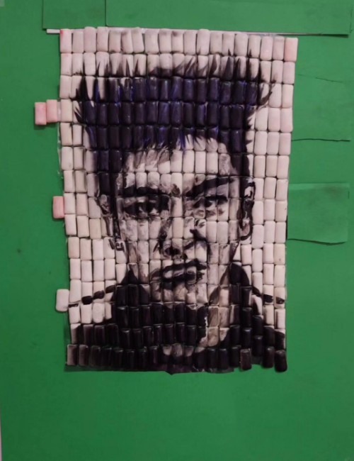 The image shows a painting of Thanos created by Ahmed Mahmoud using gum.
