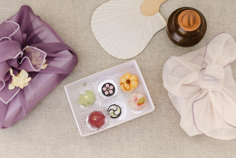 On the left are yang-gaeng jellies, in the middle are dashik (black sesame tea cookies), and on the right are songpyeon rice cakes.