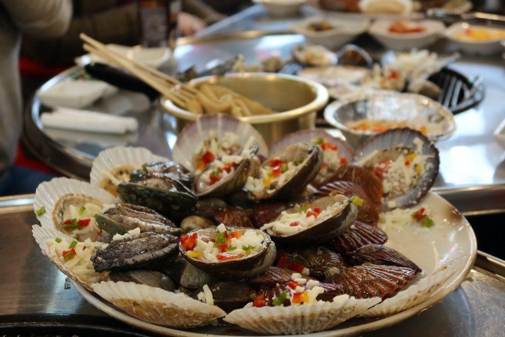 Grilled clams like these at a restaurant on Dongmak Beach are a can't-miss on Incheon's Ganghwado Island.