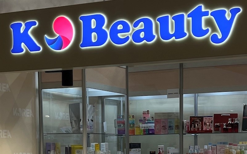 The K-beauty booths demonstrate innovative Korean skincare approaches. 