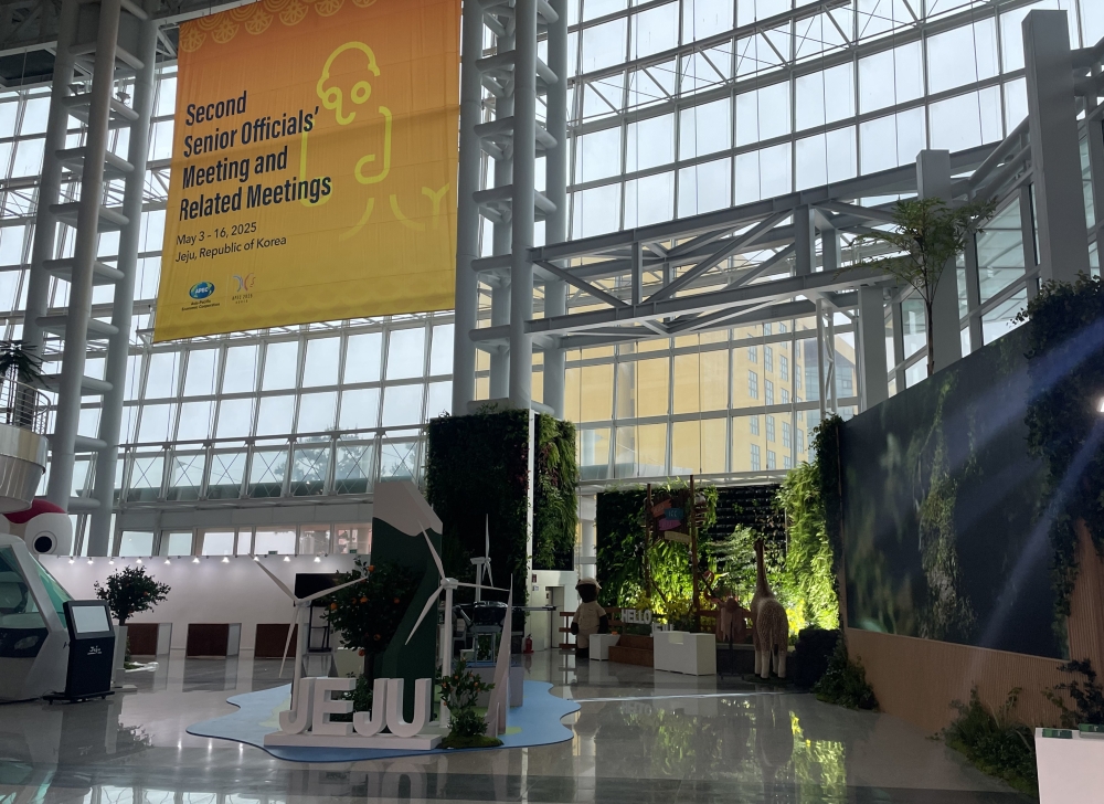 A booth at International Convention Center Jeju in Seogwipo, Jeju Island, displays the island's strategies for sustainable development and its value as UNESCO World Natural Heritage.