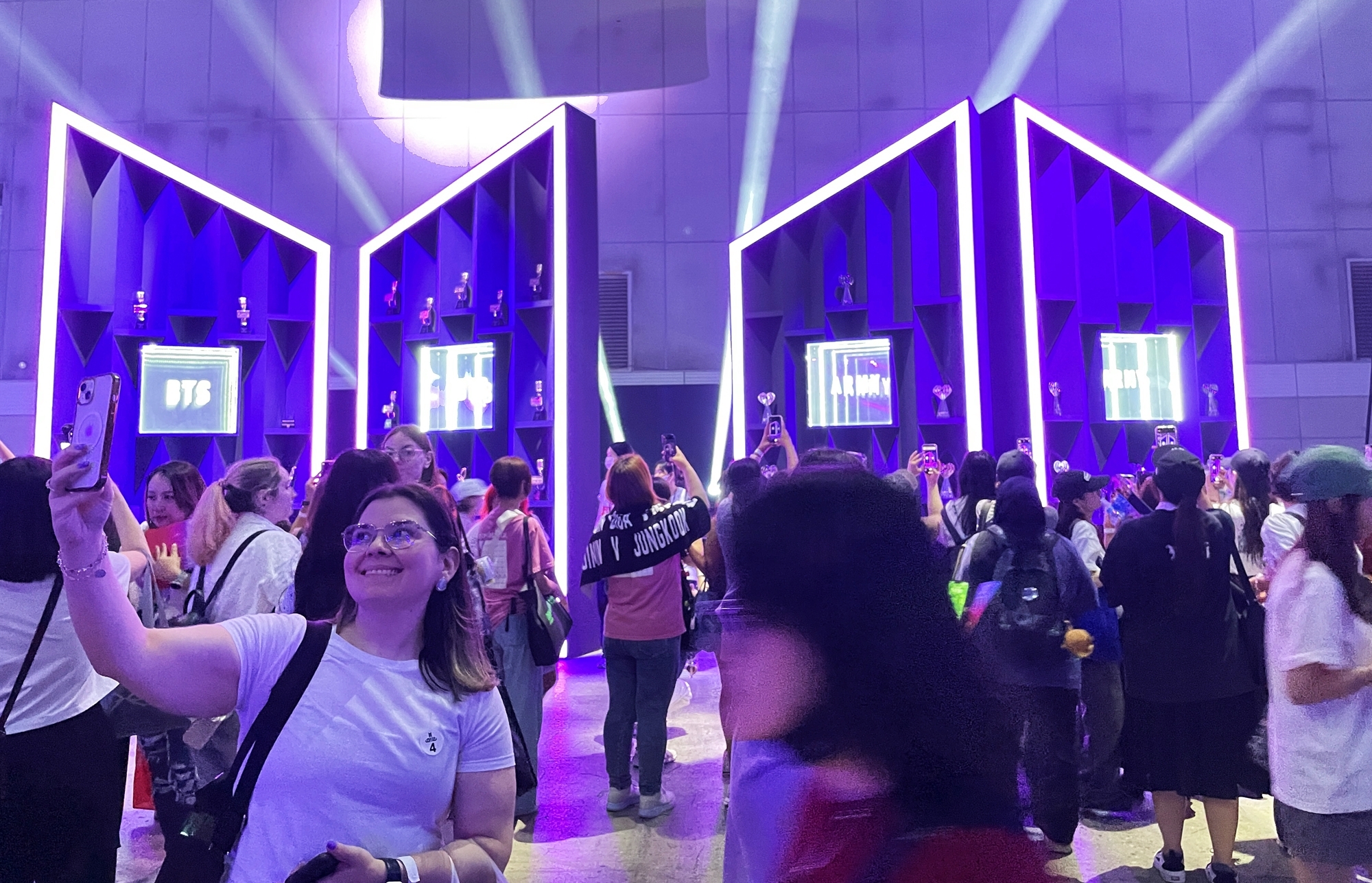 Fans of K-pop sensation BTS on June 13 take photos at the trophy zone of the 2025 BTS Festa, which marks the 12th anniversary of the boy band's debut, at Halls 9 and 10 of Exhibition Center 2 at the Korea International Exhibition Center, aka KINTEX, in Goyang, Gyeonggi-do Province. (Xi Aiying) r