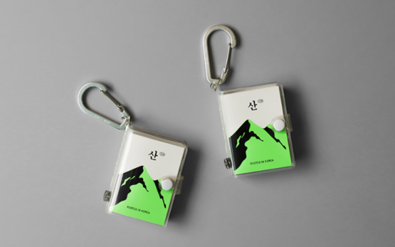 Mountain 239, a waterproof pocket-sized book featuring a mini compass and engraved carabiner, awarded Best Book Design in Korea at the 2025 Seoul International Book Fair. (Shin So-hyun)