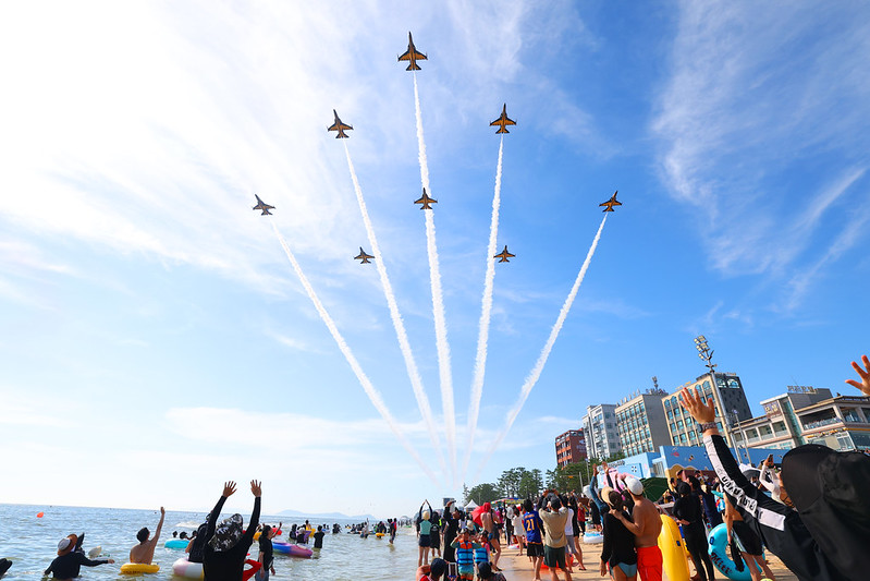 Eight Black Eagle fighters display a spectacular aerobatics show over Daecheon Beach, bringing the Boryeong Mud Festival to fever pitch.  
