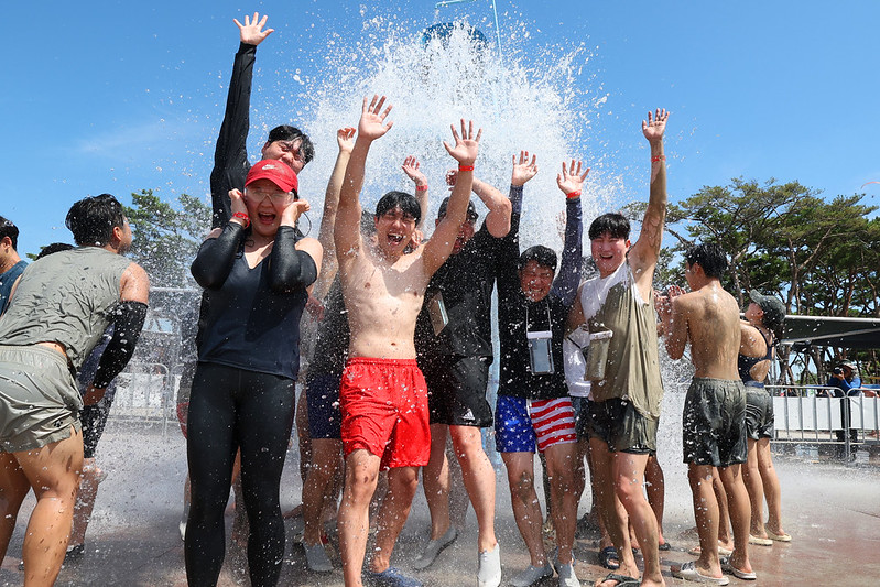 Visitors can stay cool at themed zones for mud, families and people with dogs and a water park. 