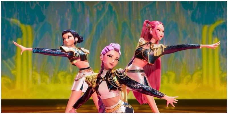 K-Pop girl group Huntr/x members (left to right) Zoey (voiced by Ji-Young), Rumi (voiced by Arden Cho), and Mira (voiced by May Hong) on stage as next-gen demon hunters (Netflix and Sony Pictures Animation)