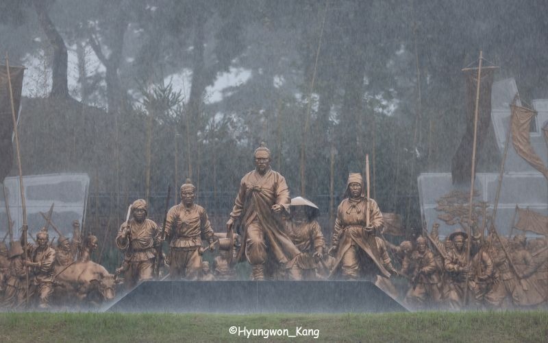 Donghak Peasant Revolution in Statues: Rain falls as Jeon Bongjun (1855–1895), a prominent military leader of the Donghak Peasant Revolution (1894–1895), leads a march of farmers in this outdoor installation of statues at Donghak Peasant Revolution Memorial Hall in Jeongeup.