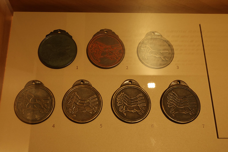 These mapae, or tablets carried by public officials allowing the use of horses at designated stations, are displayed at the exhibition 