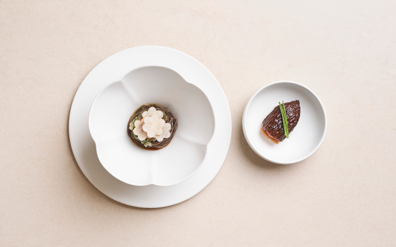 Memilmyeon and Mandu dish. Buckwheat noodles with white kimchi dressing and a side dish of acorn-shaped morel stuffed with Gochujang duck meat patty.