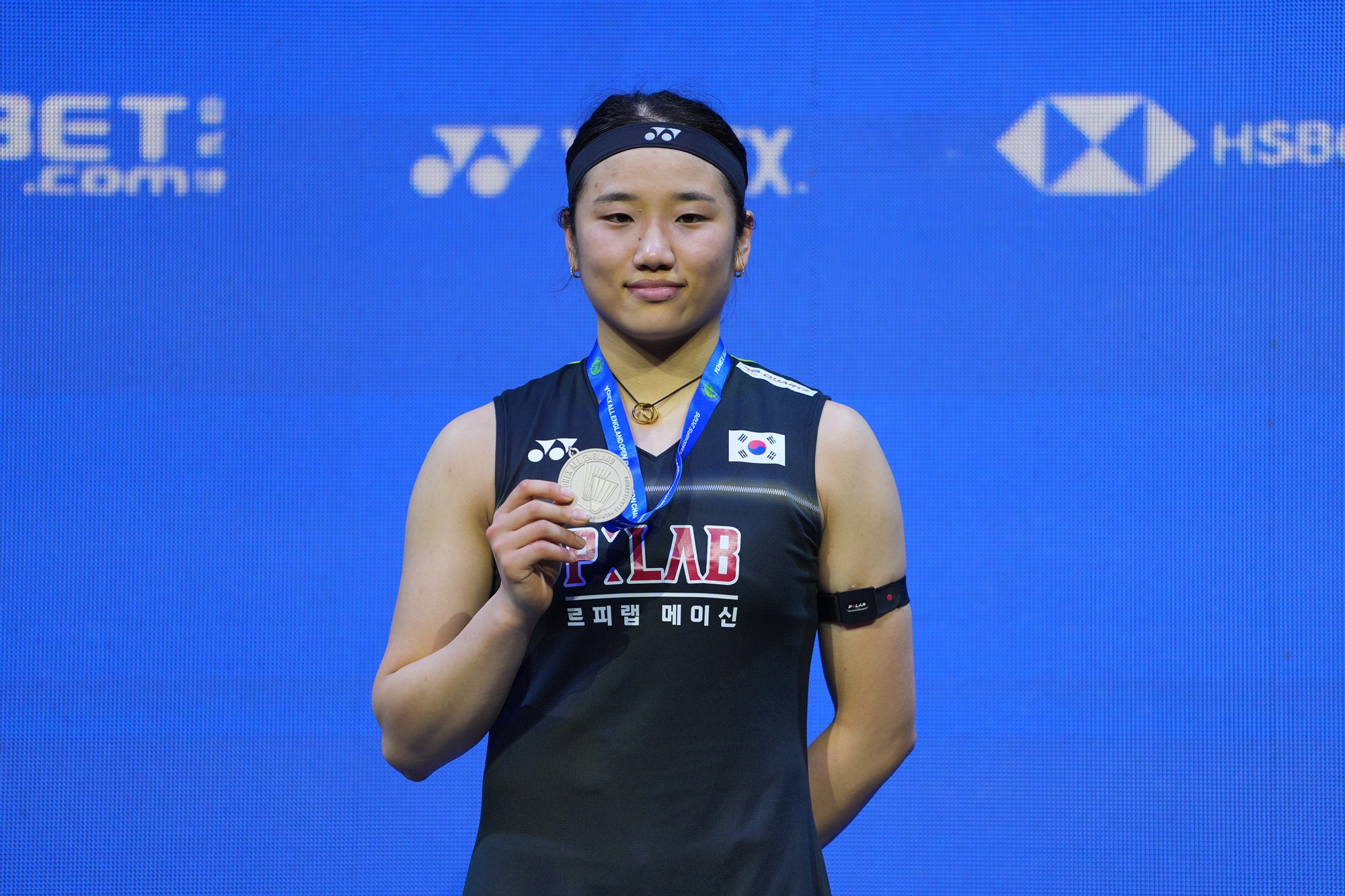 An Se Young on March 8 holds up her runner-up medal in the All England Open at Utility Arena Birmingham in Birmingham.  