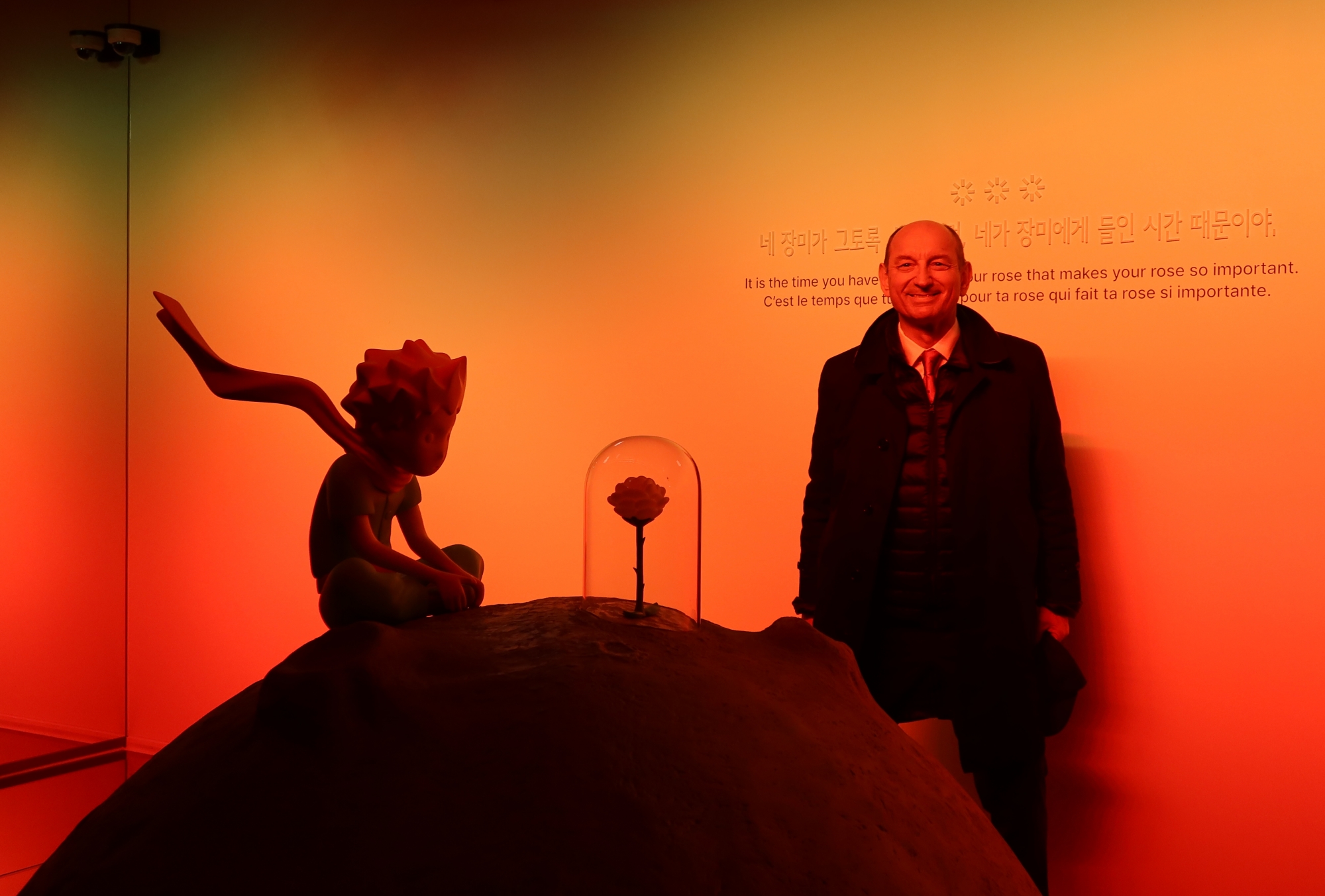 Olivier d'Agay, chairman of the Antoine de Saint-Exupery Youth Foundation and the great-nephew of the author, on March 18 takes a photo at the first-floor exhibition hall of the Little Prince House in Busan's Saha-gu District. (Charles Audouin) 