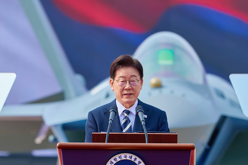 President Lee Jae Myung on March 25 speaks at the rollout ceremony for the mass production of the country's first domestically developed fighter KF-21 at Korea Aerospace Industries in Sacheon, Gyeongsangnam-do Province. 