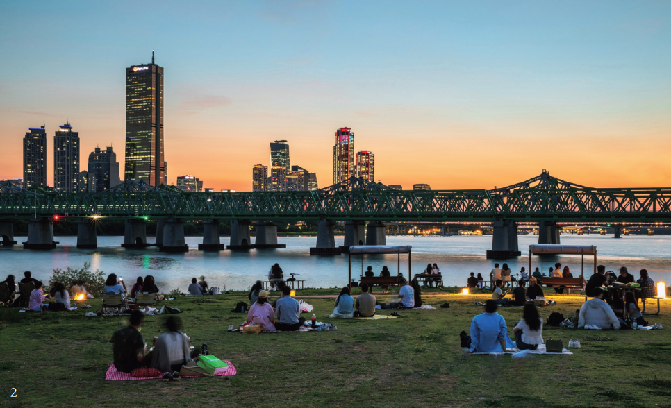 2. View of the Hangang River and Yeouido from Nodeulseom Island, Seoul In densely populated Seoul, public spaces such as Nodeulseom Island and robust urban infrastructure are key to enhancing the quality of life of residents.